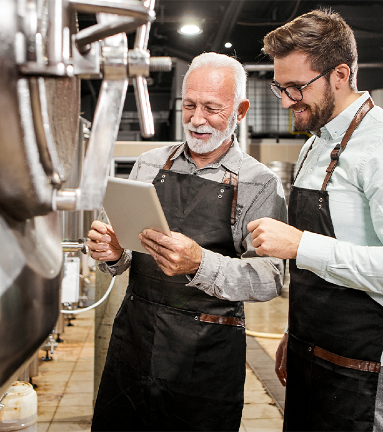Two generations discussing something on a tablet device.