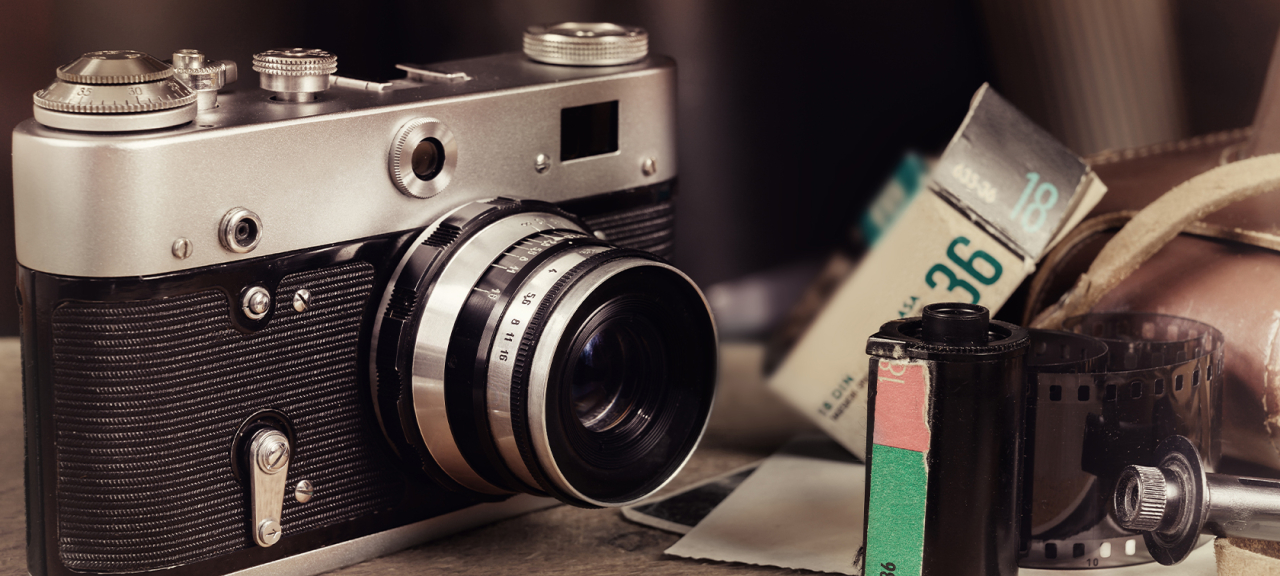 Old camera with rolls of film.