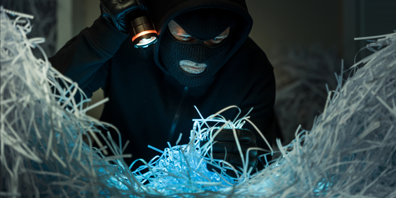 Theif trying to steal information from documents.
