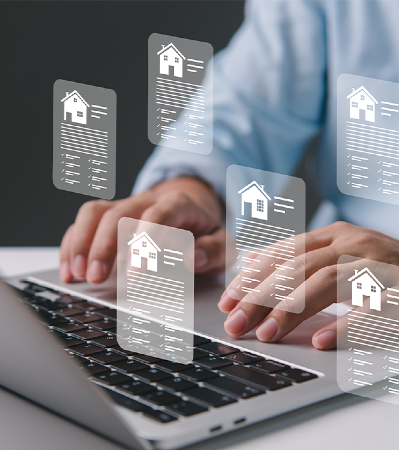 Laptop open with mock up house information cards.