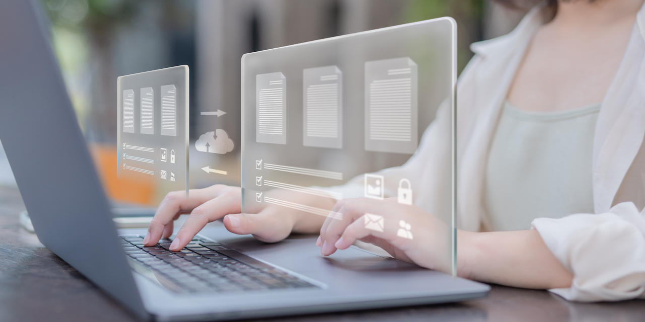 Woman working on computer with file transfer overlay.