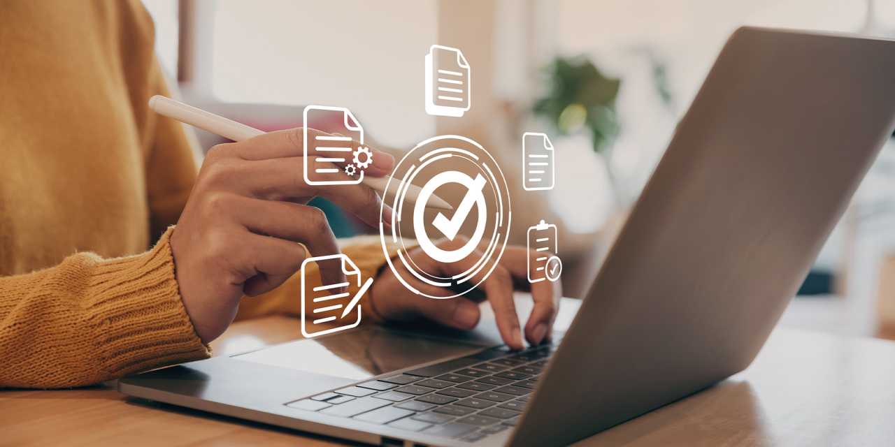 Woman working on screen with touch pen and document overlays.