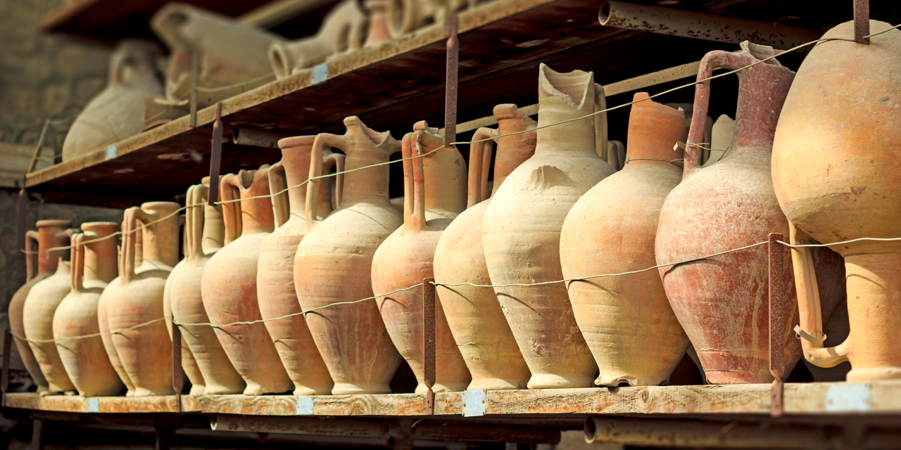 Ceramic vases of heritage importange on a shelf.