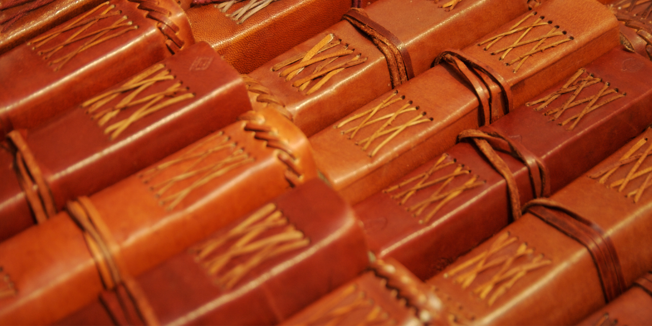 Hand crafted spines of diaries.