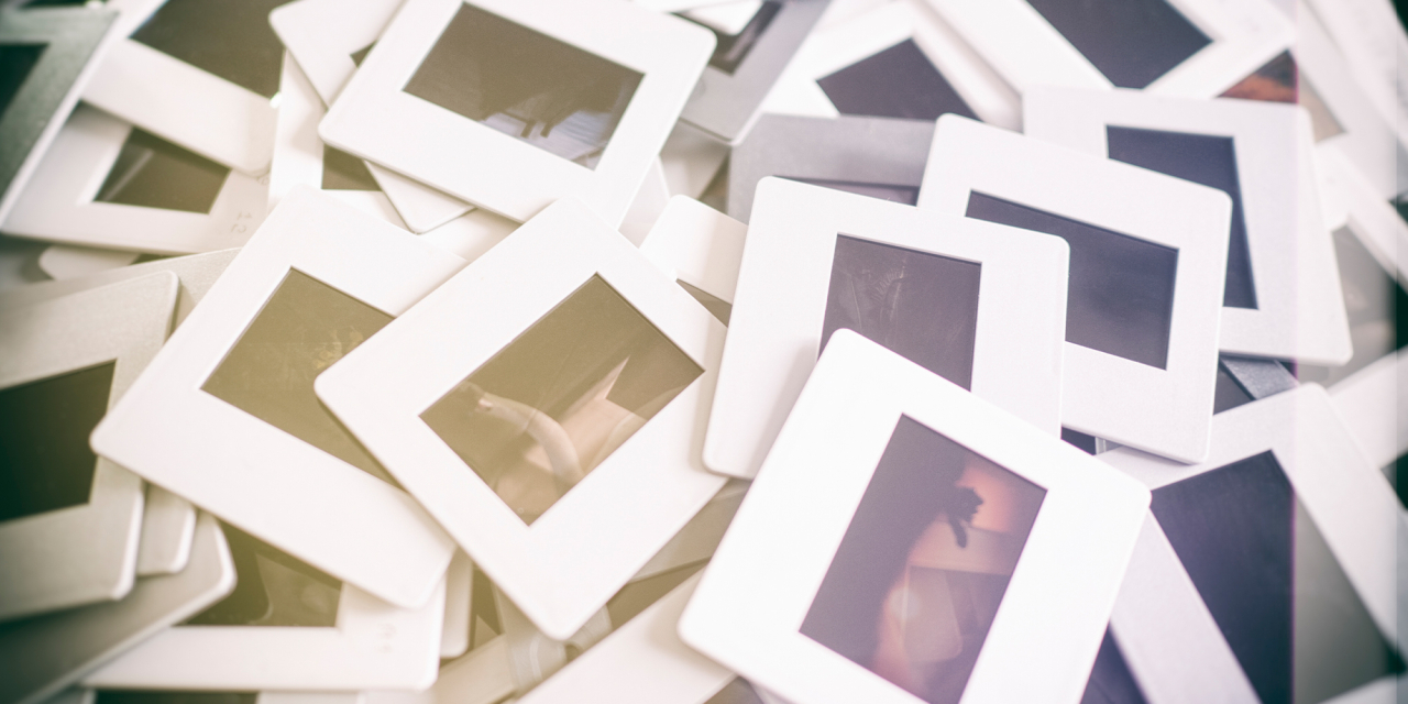 Pile of 35mm slides in frames.
