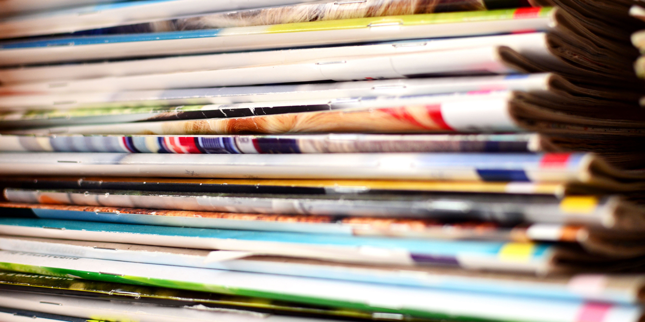 Stack of colourful magazines.