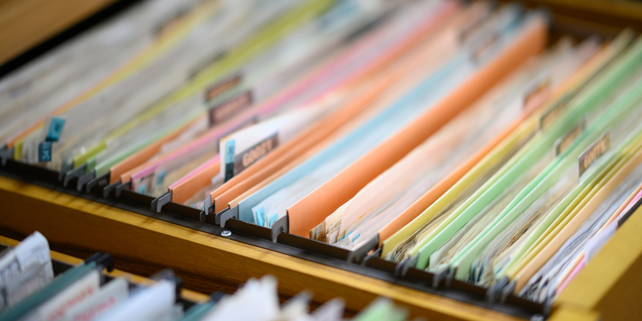 Personnel files in a drawer system.