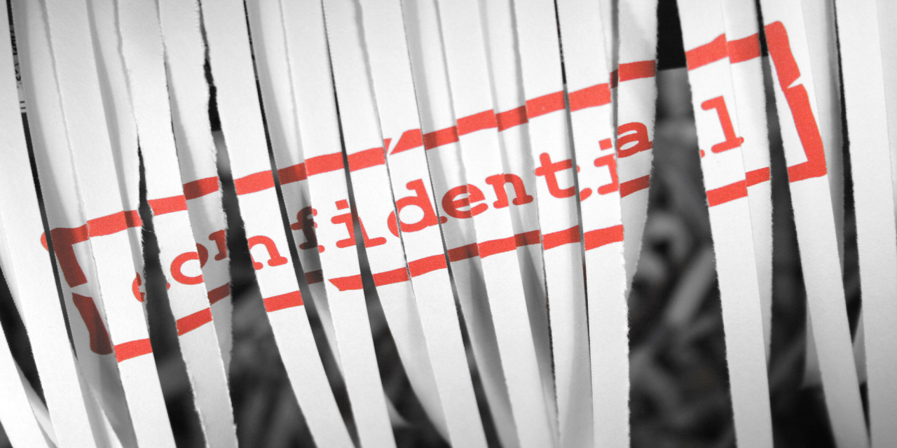 Shredded paper over the word 'Confidential' in red ink.