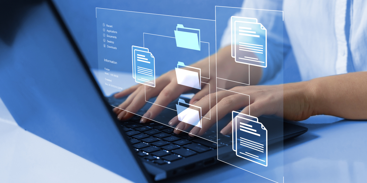 Person typing on computer keyboard with folder icon overlay.