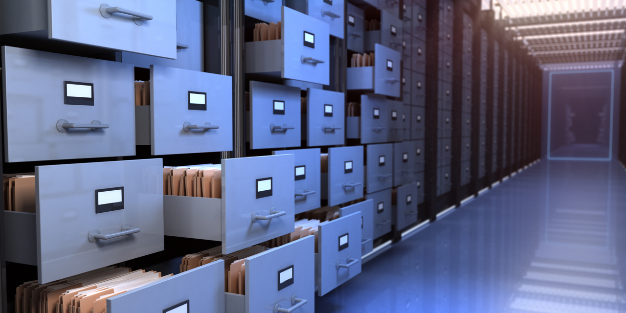 Open filing cabinets in a storage vault.