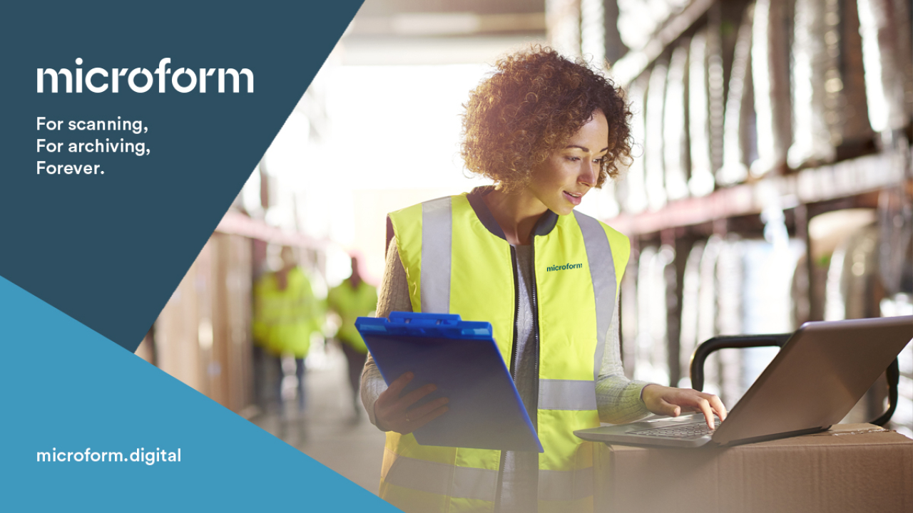 Microform Branding - Female worker looking at a laptop.