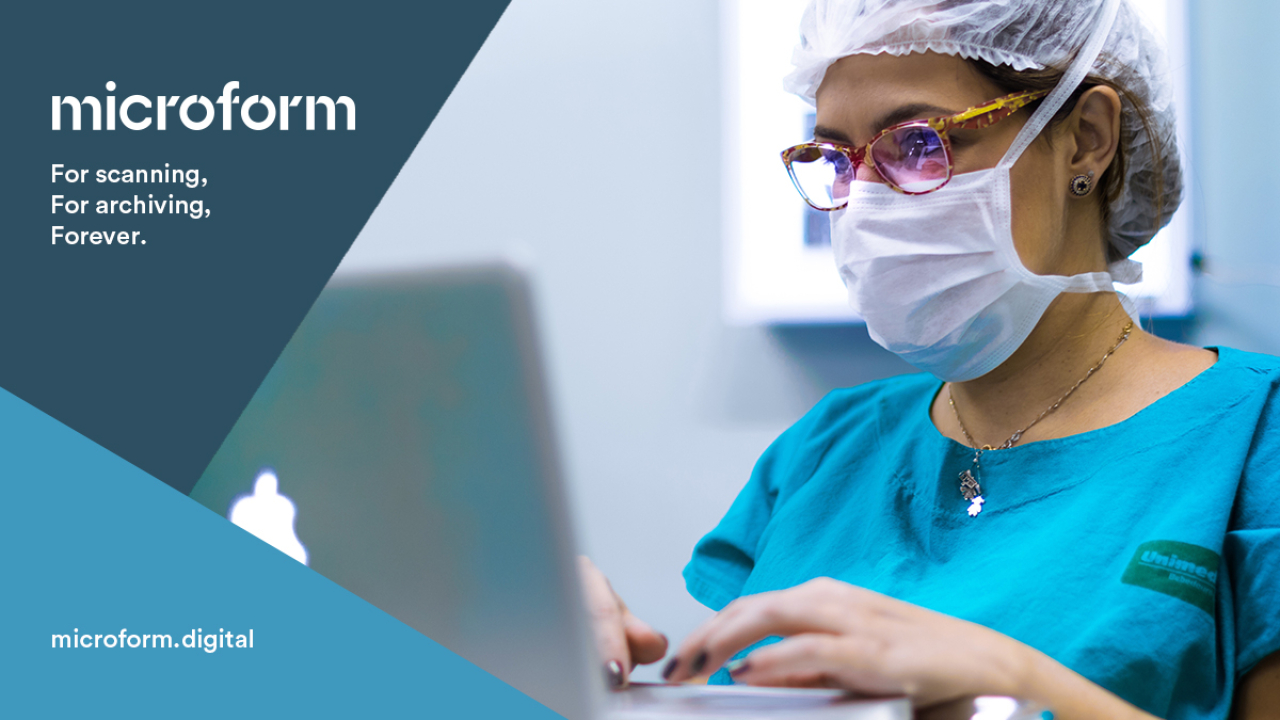 Microform Branding - Doctor viewing information on a digital screen.