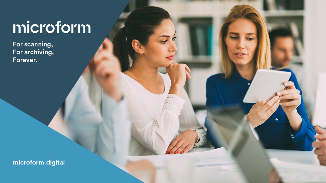 Microform Branding - Colleagues viewing information on a tablet device.
