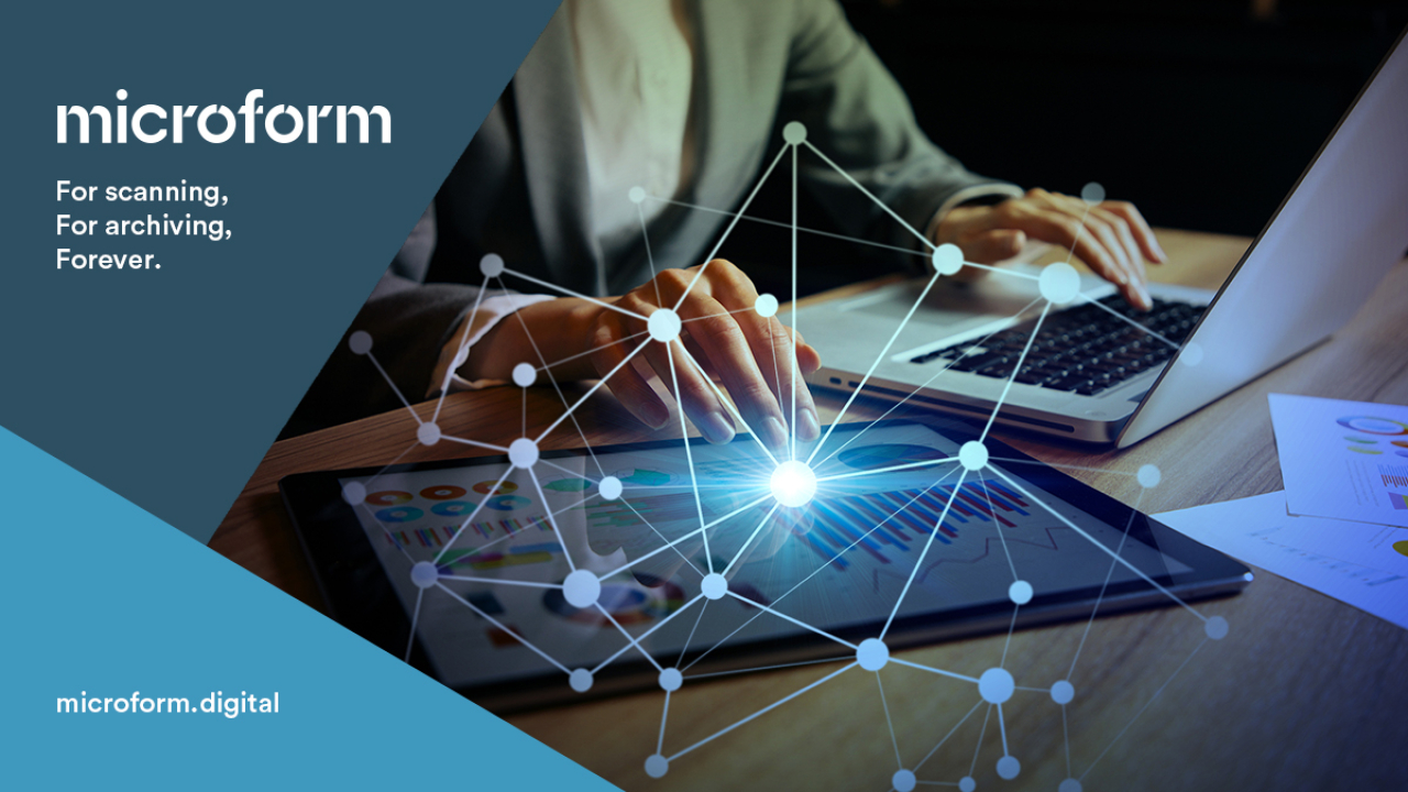 Microform Branding - Person on laptop viewing documents.