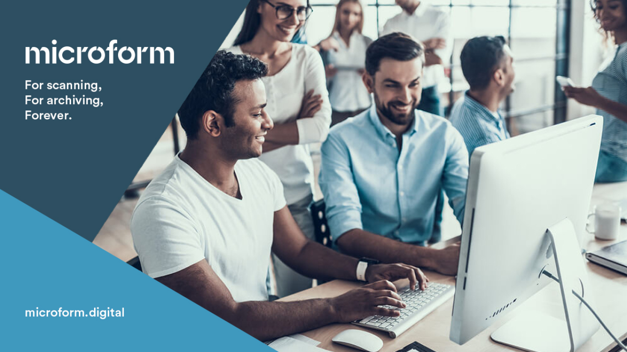 Microform Branding - Work colleagues around a computer.