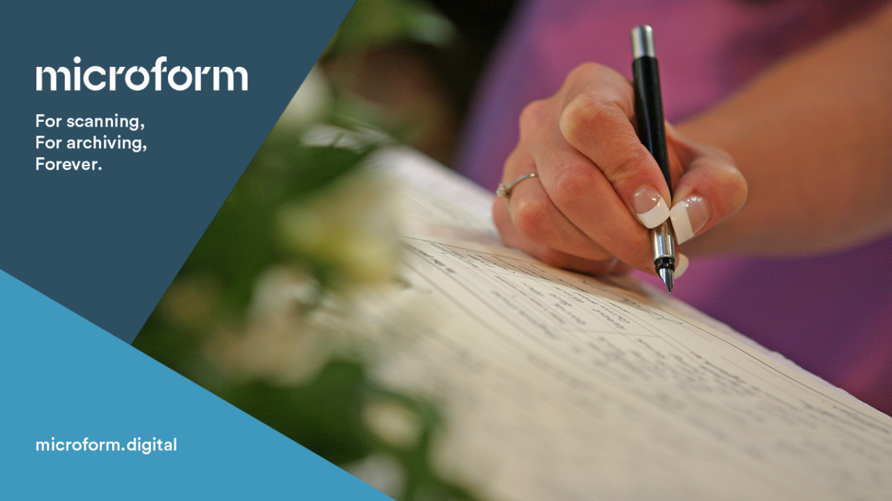 Microform Branding - Woman's hand signing register.